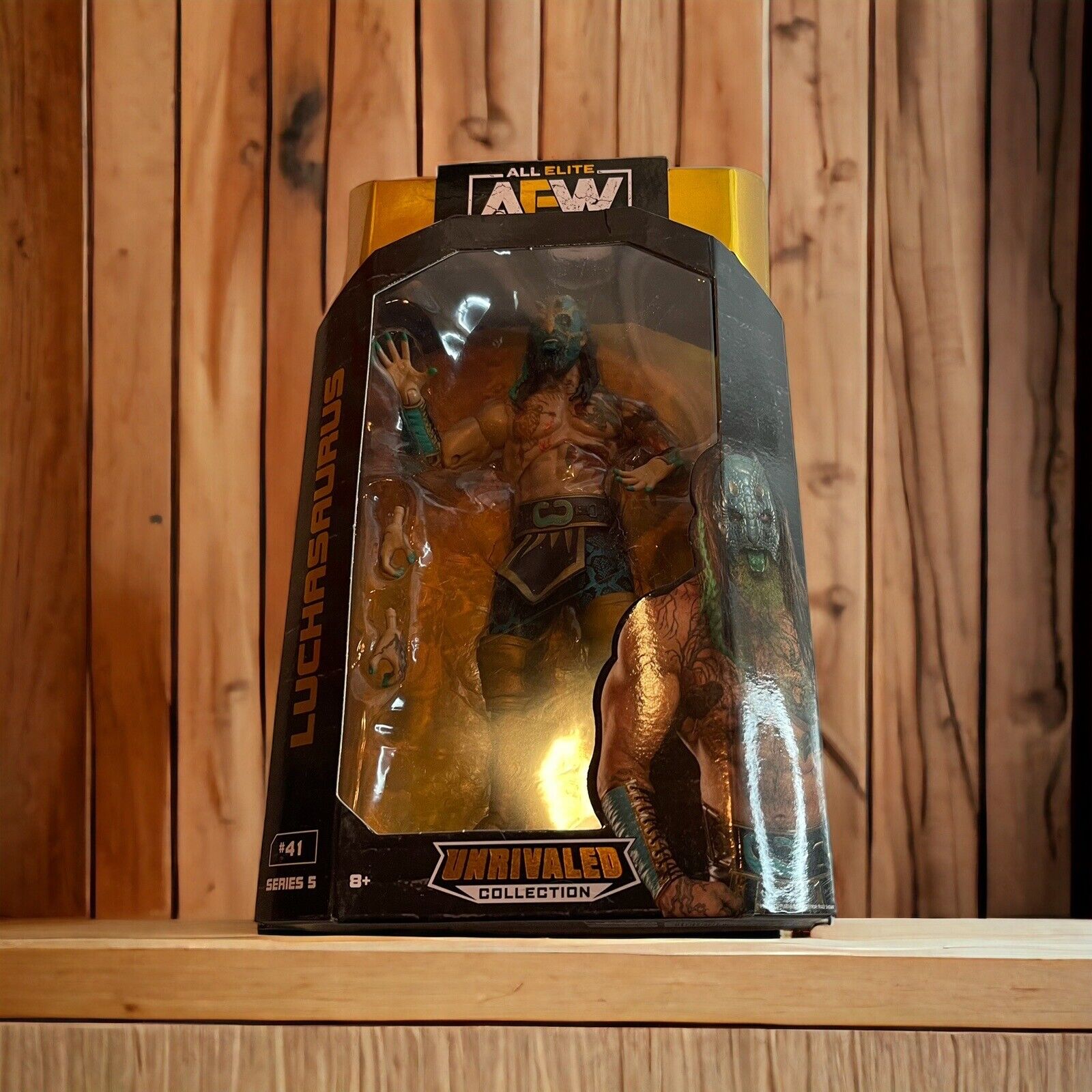 AEW Luchasaurus action figure in black and gold Unrivaled Collection packaging by 1118 Emporium