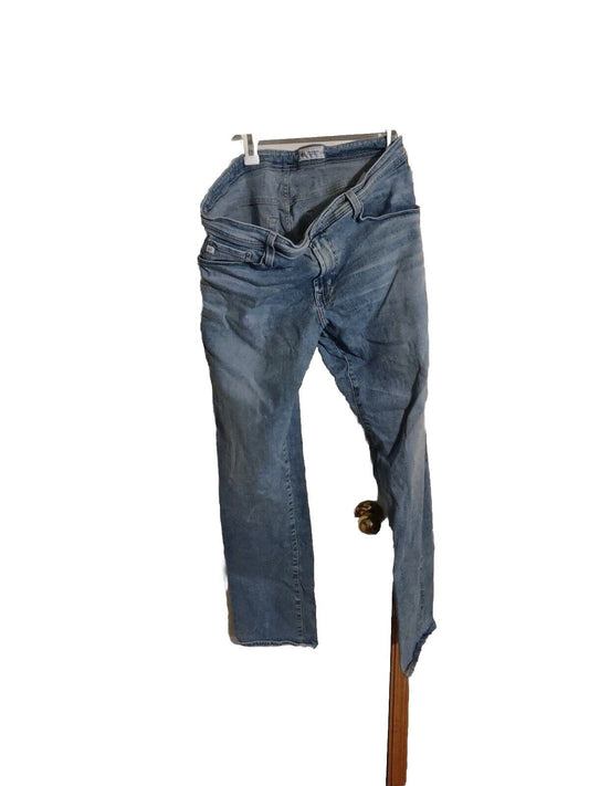 Worn blue AG Adriano Goldschmied jeans men hanging on clip against white background