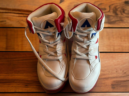 Airwalk men’s sneakers size 10 in white with red and blue accents shown from the top on wooden floor