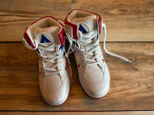 White and red high-top Airwalk sneakers size 8.5 with laces on wooden floor background