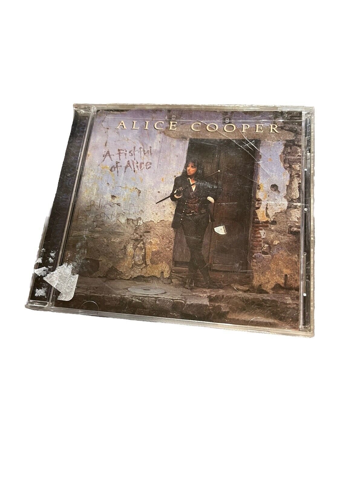 Alice Cooper A Fistful of Alice CD album cover with artist standing in front of weathered wall