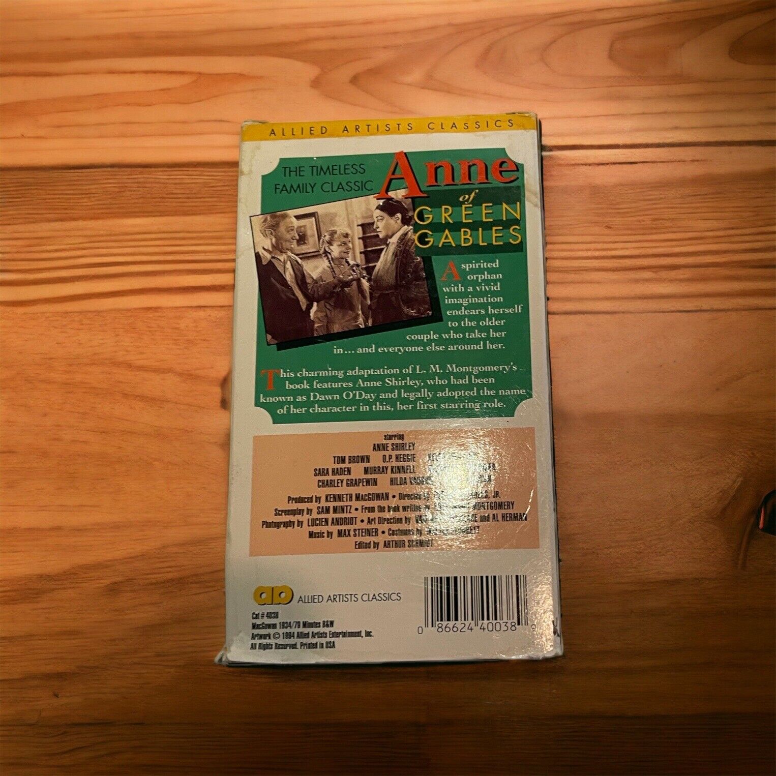 Anne of Green Gables VHS tape with classic cover art and detailed back description on wooden surface