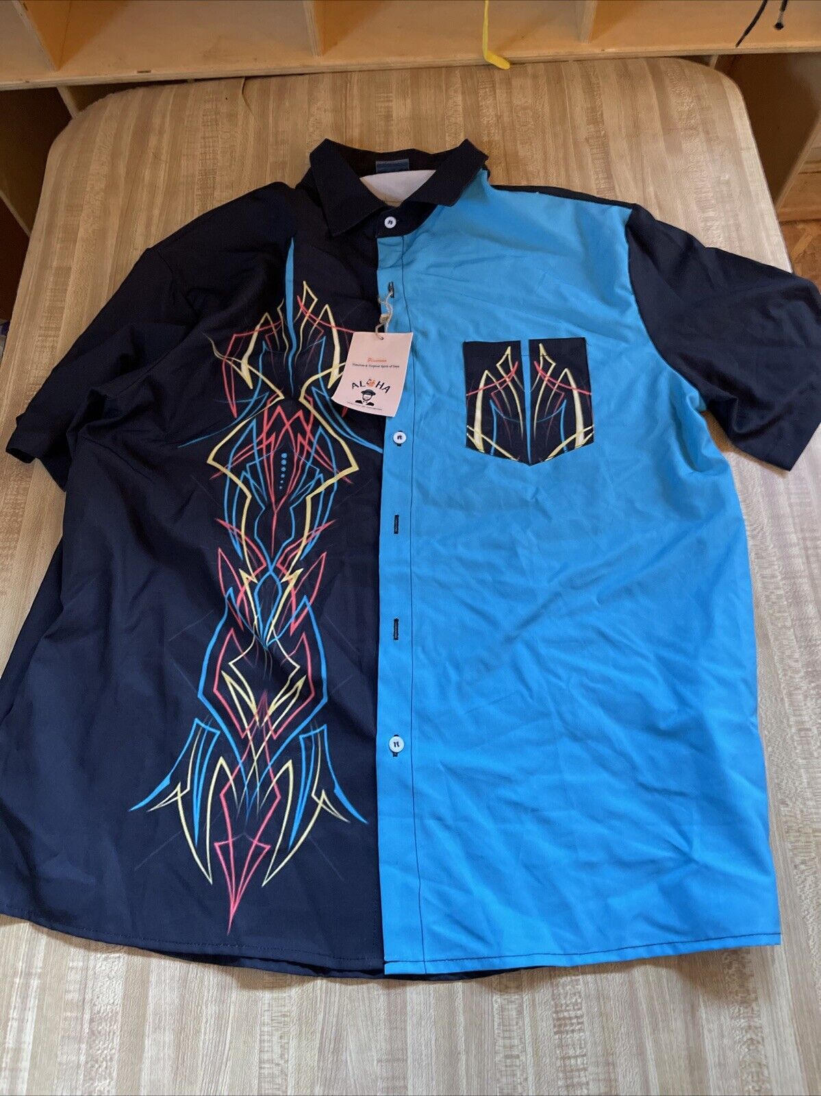 Aloha Hawaiian bowling shirt by 1118 Emporium with black and blue color block and colorful geometric embroidery