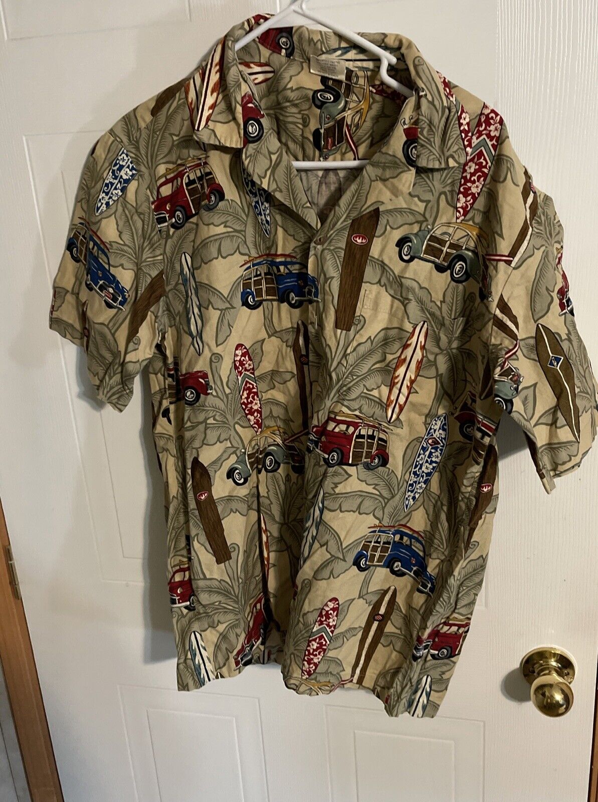 Aloha Republic Hawaiian shirt XL with vintage surfboard and car print hanging on white door