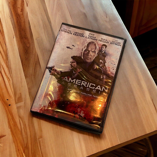 American Assassin DVD case with action-packed cover featuring main characters on a wooden table