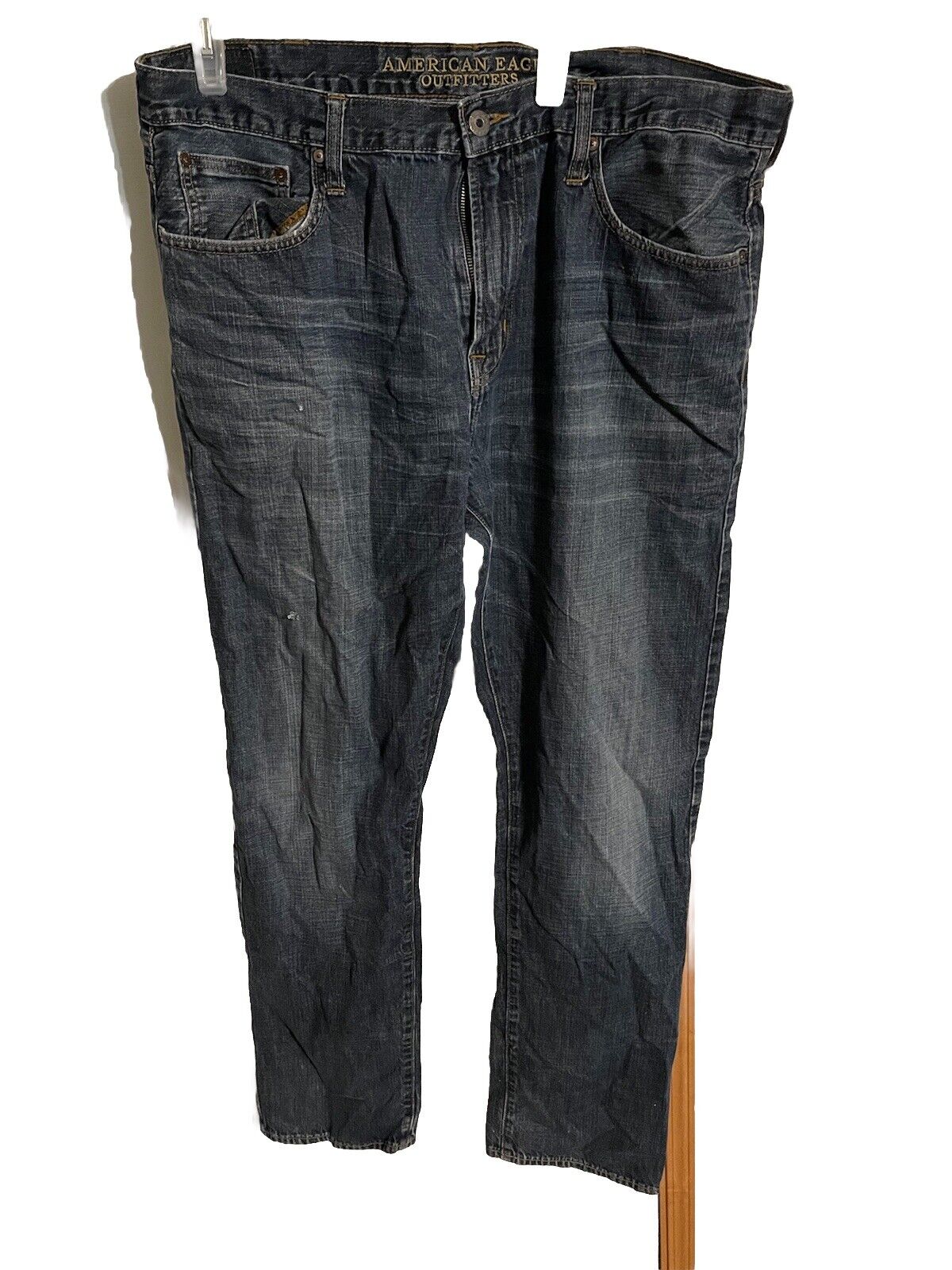 American Eagle jeans 38x36 in dark wash with classic five-pocket design hanging against white background