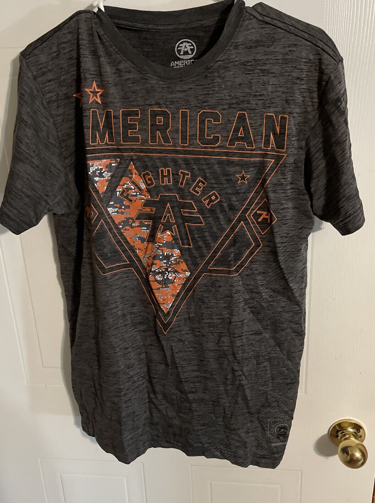 American Fighter t shirt large in black with orange graphic design and distressed print