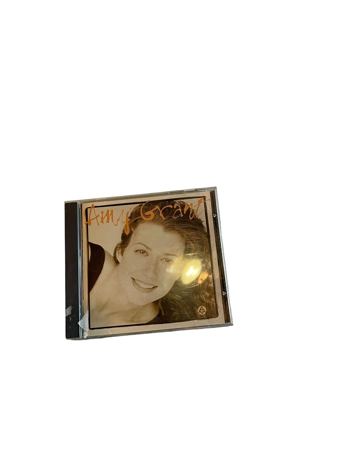 Amy Grant House of Love CD album cover with Amy Grant's smiling portrait in sepia tone