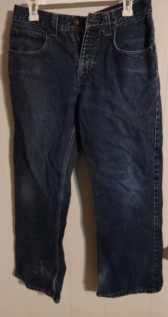 Anchor Blue bootcut jeans in dark wash hanging on white clips