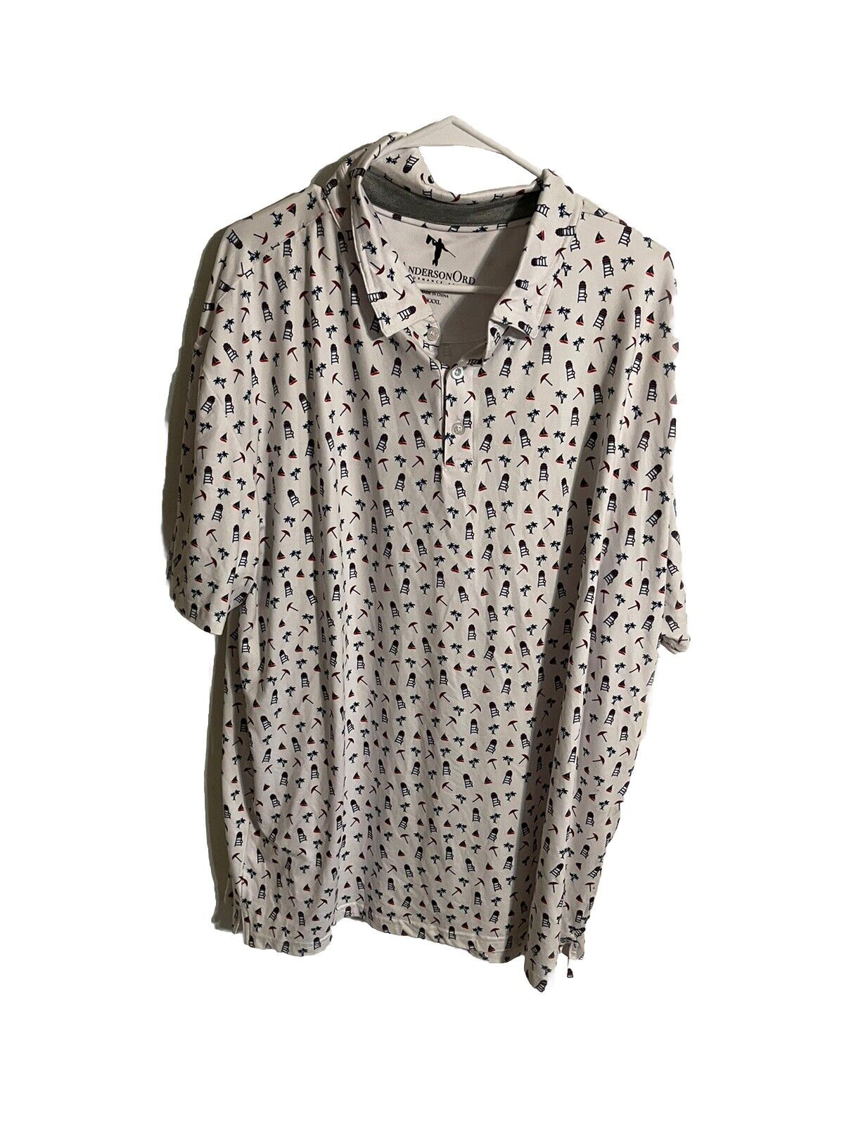 Anderson Ord golf polo XXXL in light beige with small golfer silhouette pattern hanging on white hanger