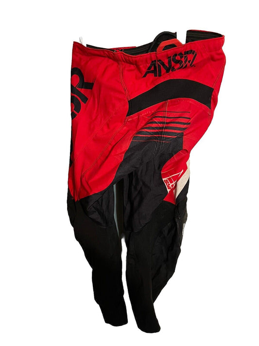 Red and black Ansr Syncron motocross pants designed for durability and comfort