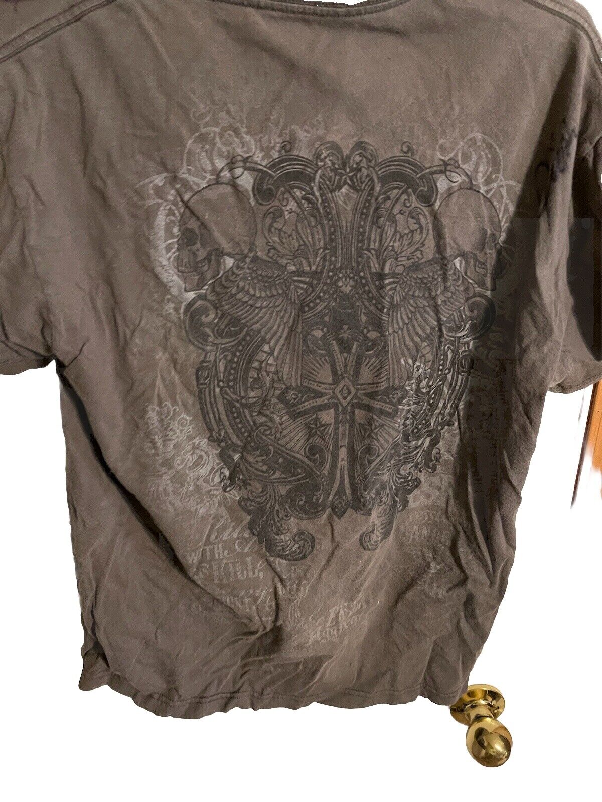 Apostasy Eternal Agony autographed shirt with intricate gothic cross and winged skull design on brown fabric