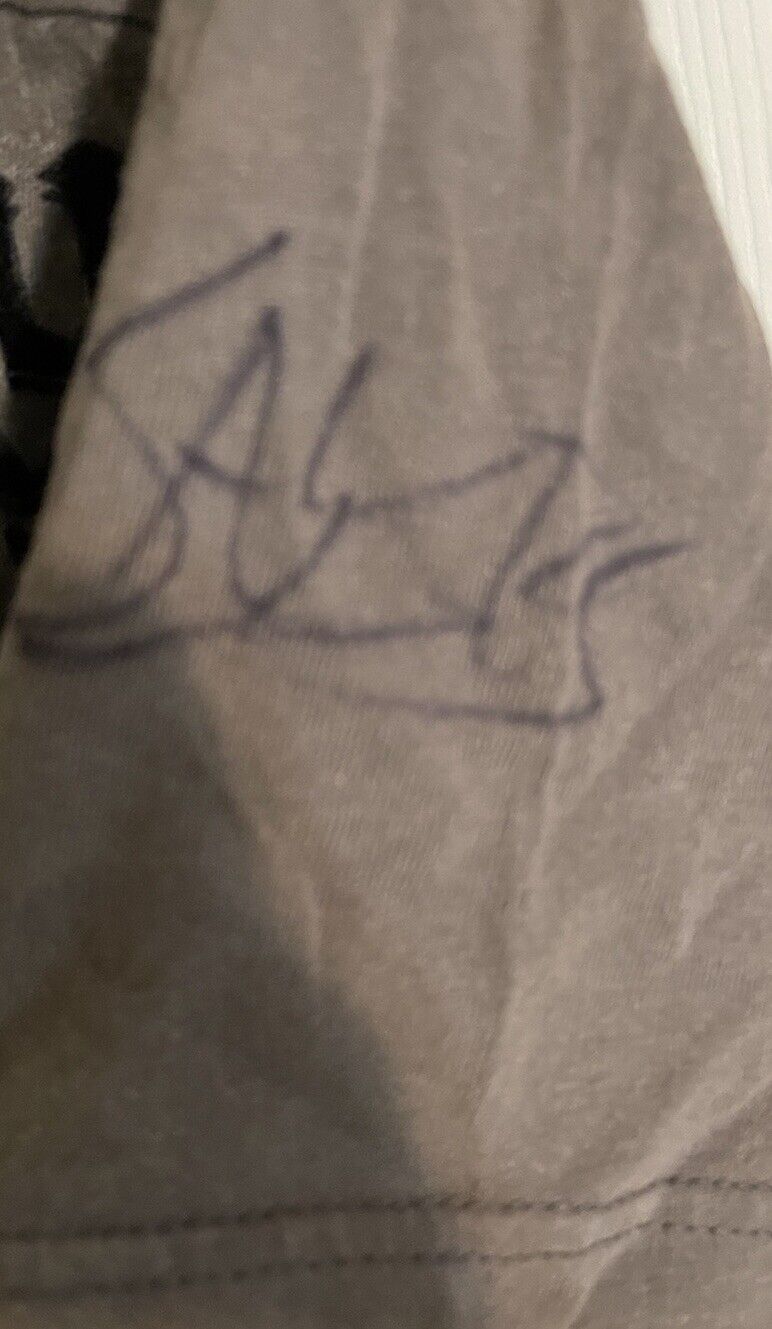 Close-up of Apostasy Eternal Agony autographed shirt showing signature on fabric