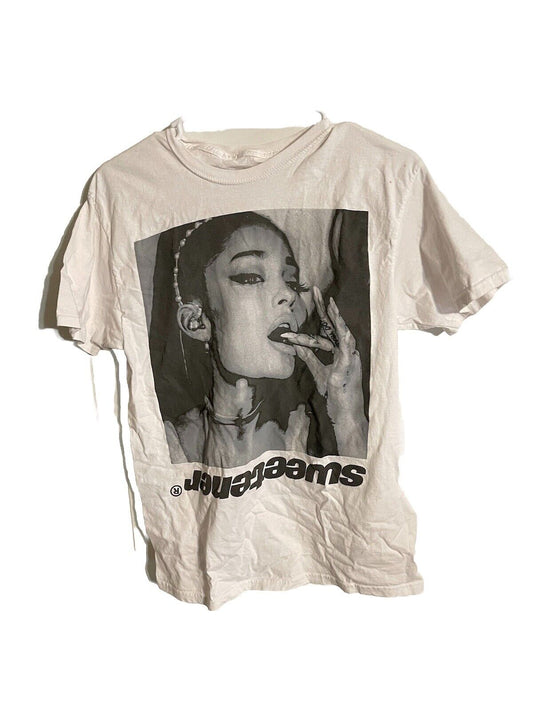 Beige Ariana Grande Sweetener tour shirt with black and white close-up photo of Ariana Grande smoking