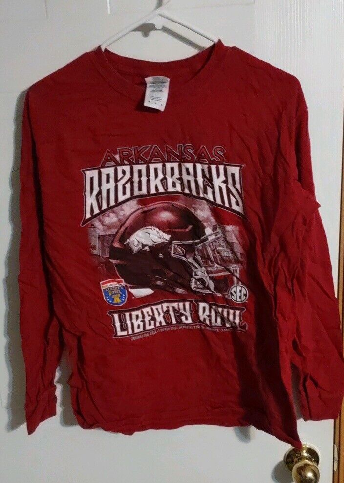 Arkansas Razorbacks long sleeve shirt in red with football helmet graphic and Liberty Bowl text
