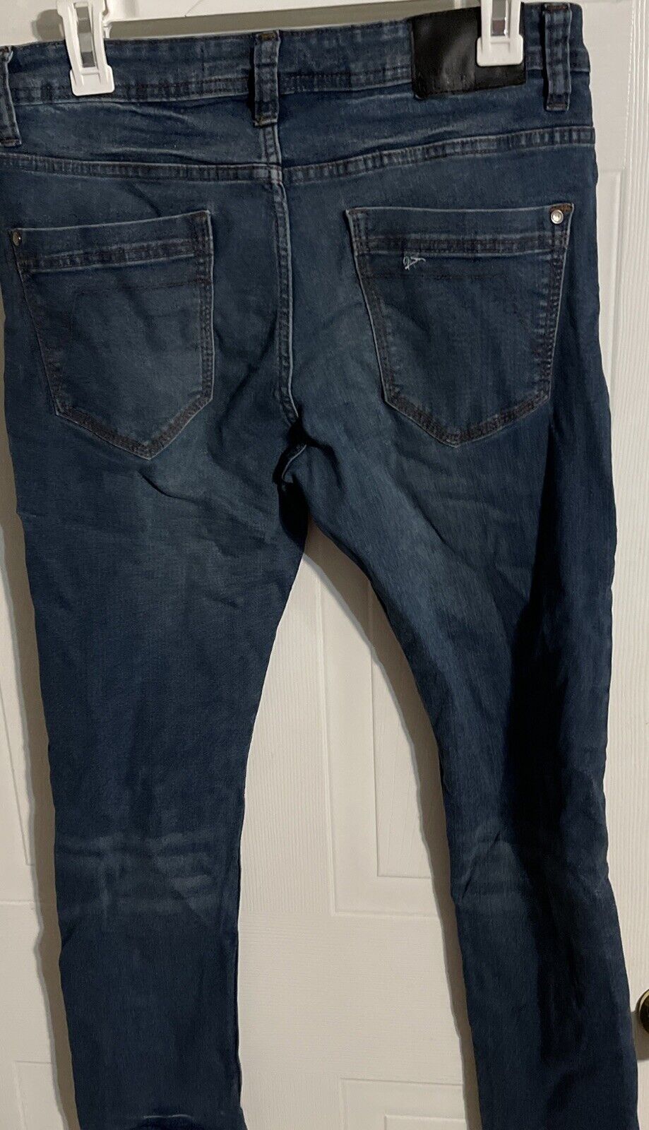 Back view of Artful Rebel jeans 32x30 in dark blue denim with pockets and belt loops