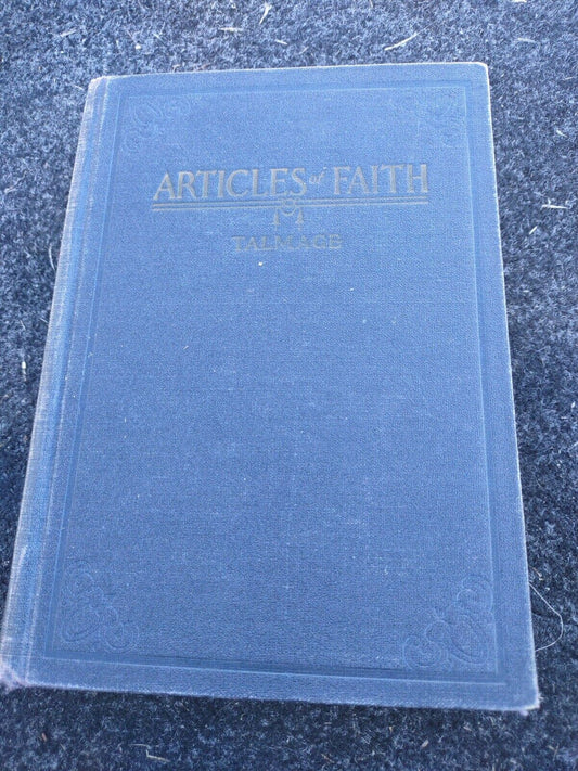 Blue hardcover Articles of Faith book by F.S. Wallace with gold embossed text on the cover