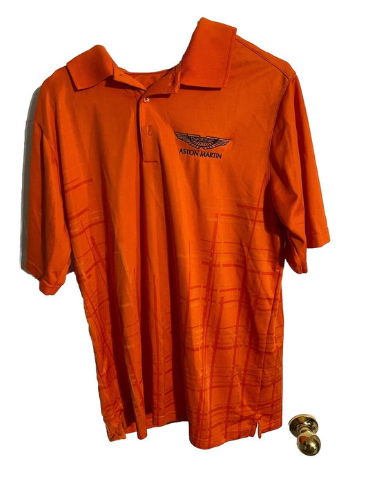 Orange Aston Martin polo shirt with black logo embroidery and subtle pattern on fabric