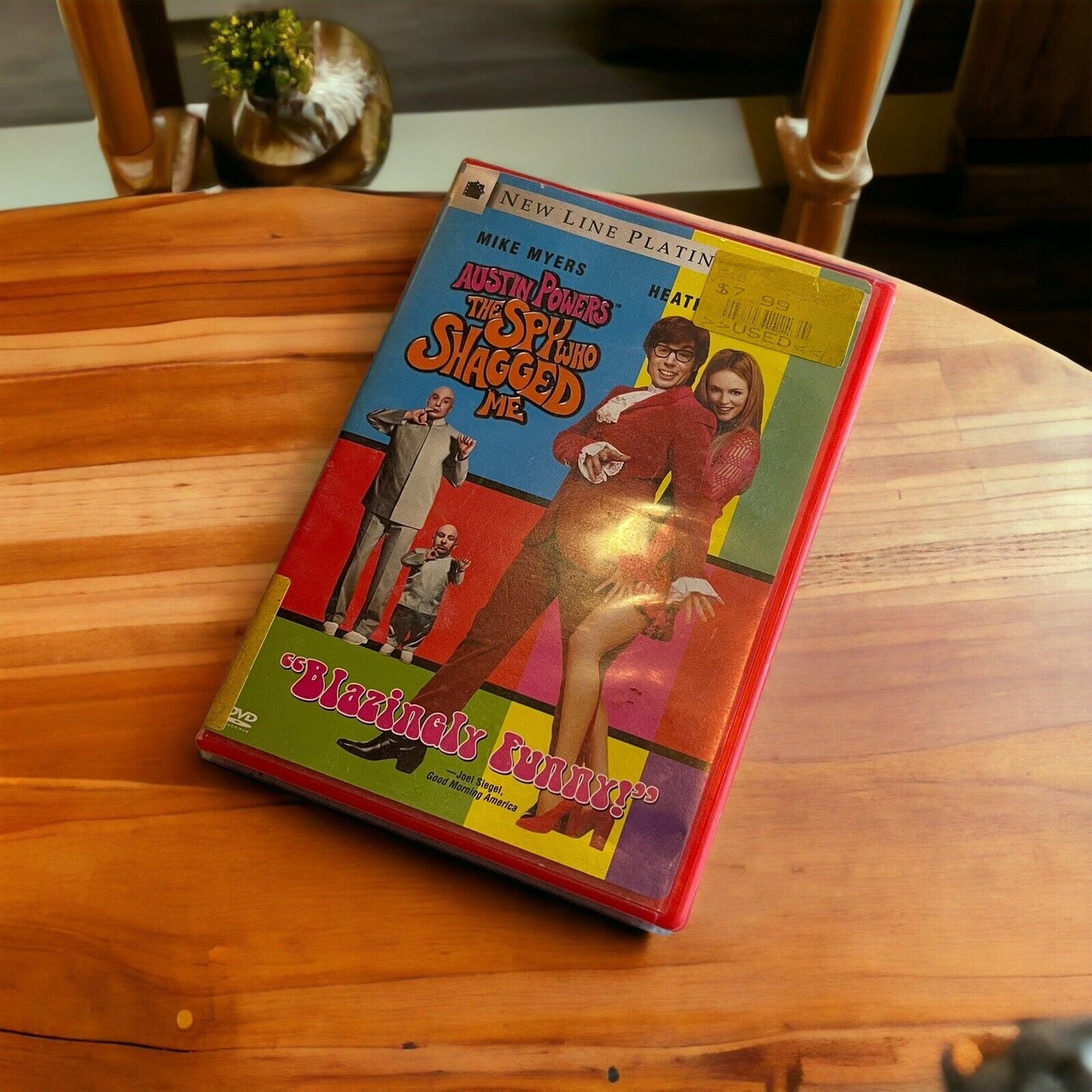 Austin Powers DVD 1999 edition of The Spy Who Shagged Me with colorful cover on wooden table