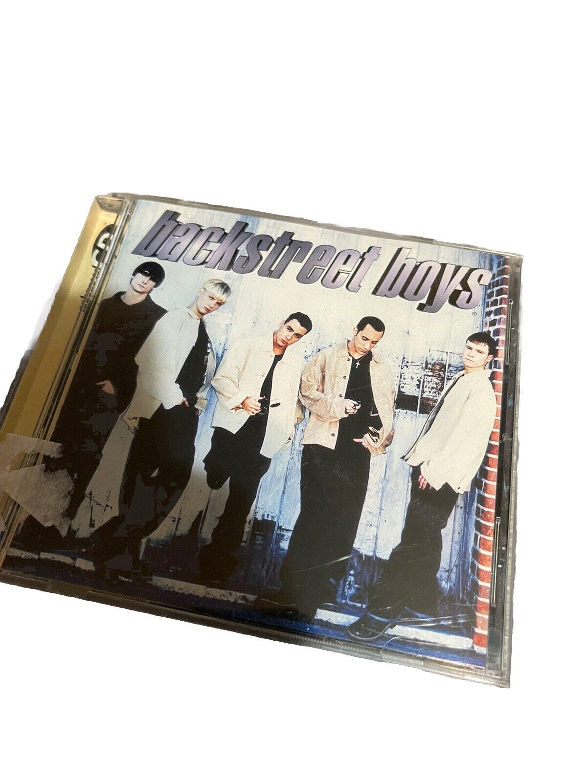 Backstreet Boys album CD featuring the boy band in stylish outfits standing against an urban background