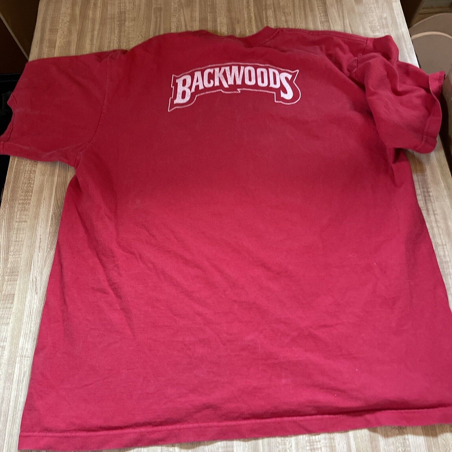 Red Backwoods Grill t-shirt with white Backwoods logo printed on the back