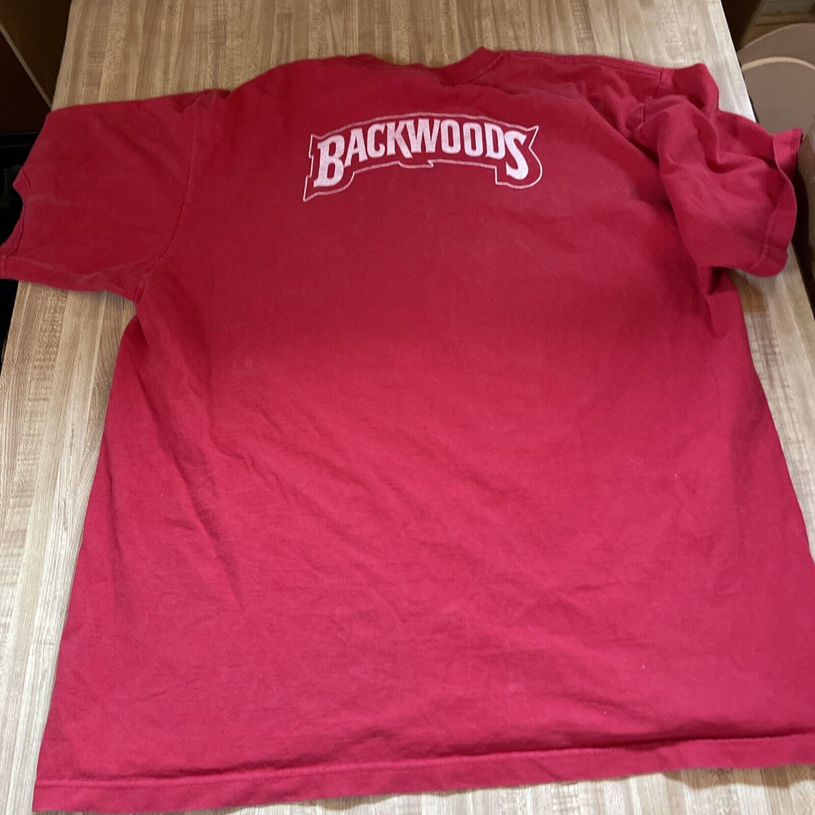Red Backwoods Grill t-shirt with white Backwoods logo printed on the back
