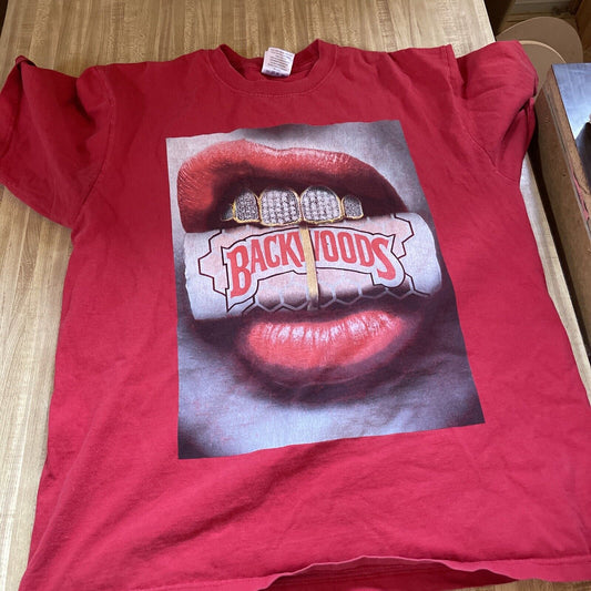 Red Backwoods Grill t-shirt featuring lips with gold teeth holding a Backwoods cigar pack
