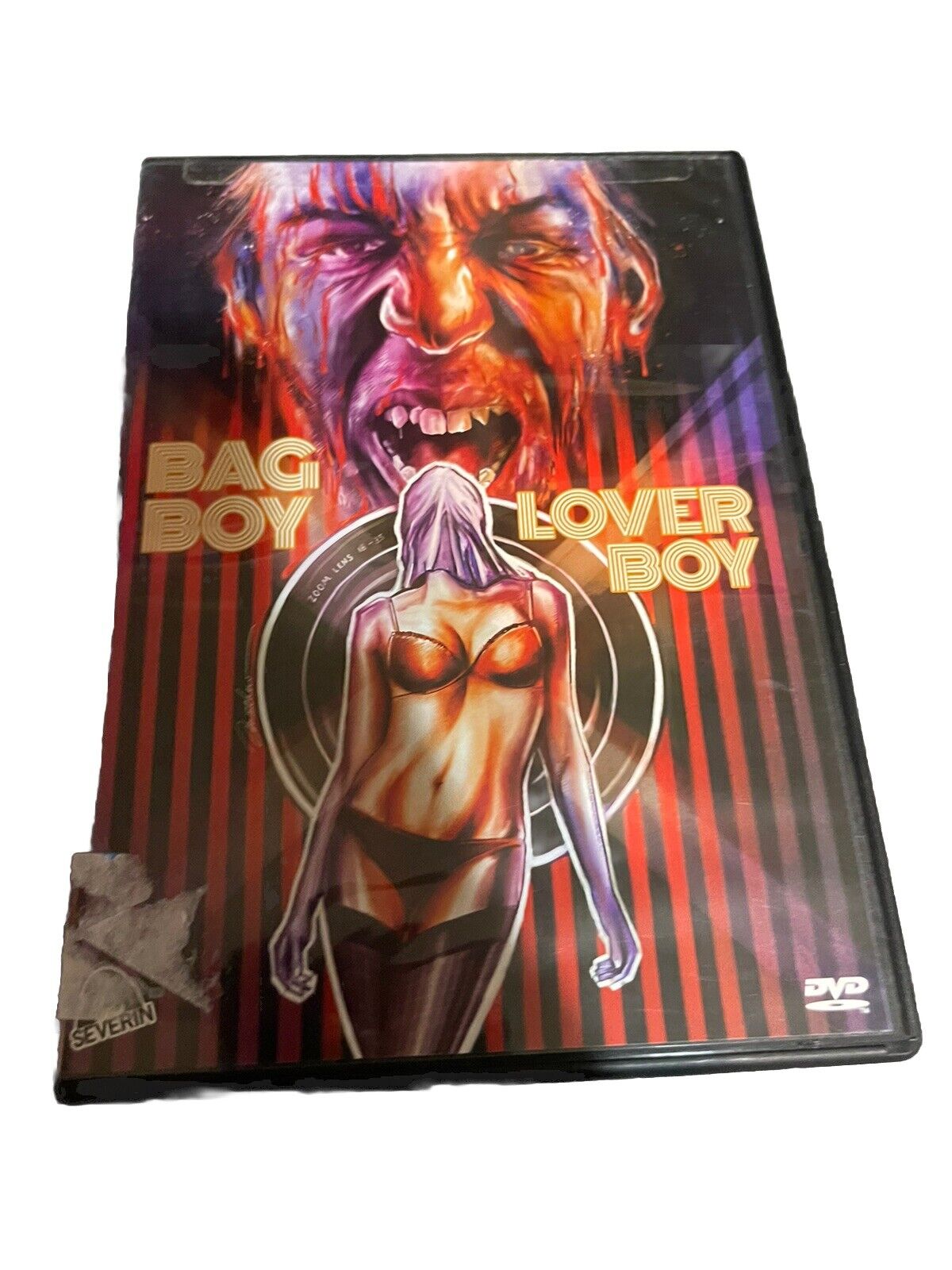 Bag Boy Lover Boy DVD with intense horror-themed cover art featuring a menacing face and a woman in lingerie