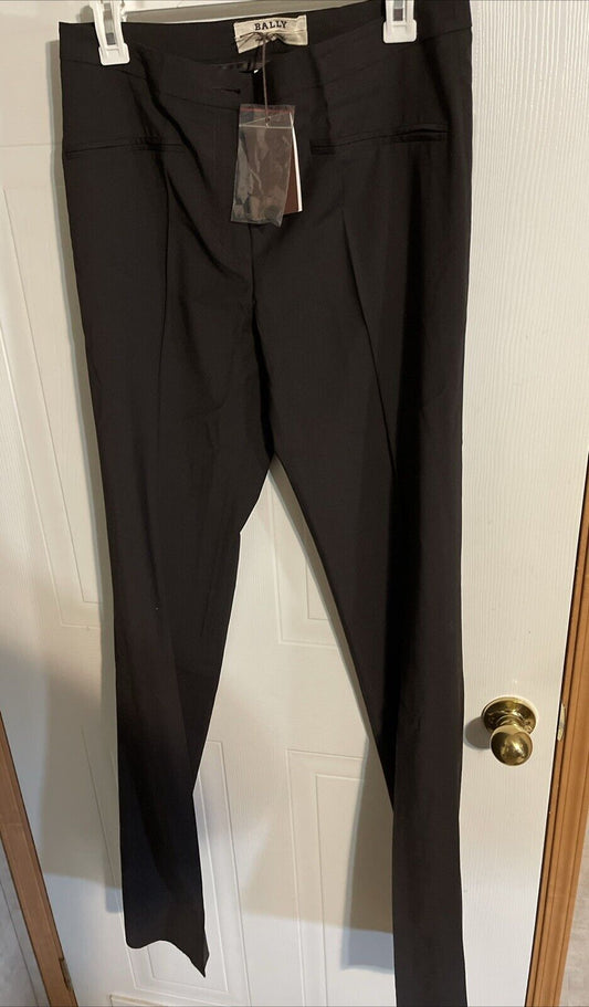 Black Bally dress pants for women hanging on a white door with tags attached
