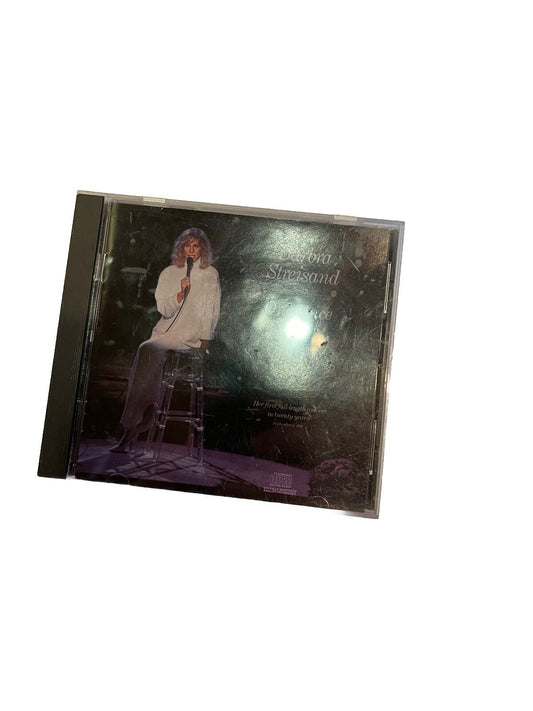 Barbra Streisand One Voice CD featuring cover image of Barbra Streisand seated with microphone