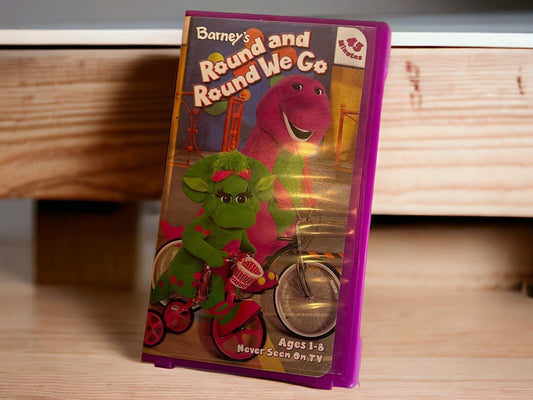 Barney Round and Round We Go VHS tape featuring Barney and friend on a bike for kids ages 1 to 8
