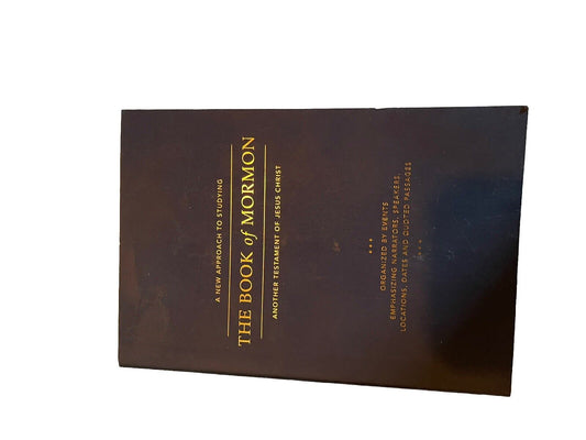 1118 Emporium Book of Mormon study guide with dark cover and gold lettering