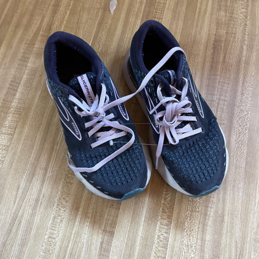 Brooks Glycerin GTS 20 women’s size 7 running shoes in black with white laces on wooden floor