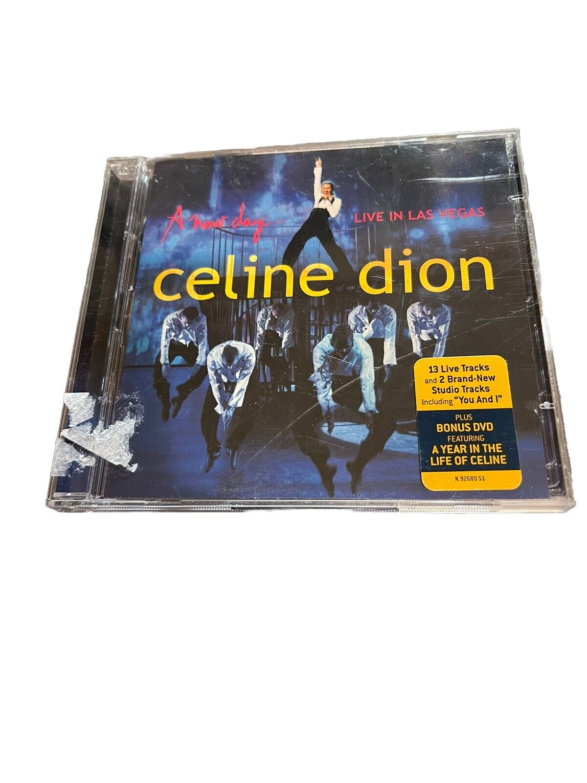 Celine Dion A New Day Live in Las Vegas album cover with stage performance images and yellow text