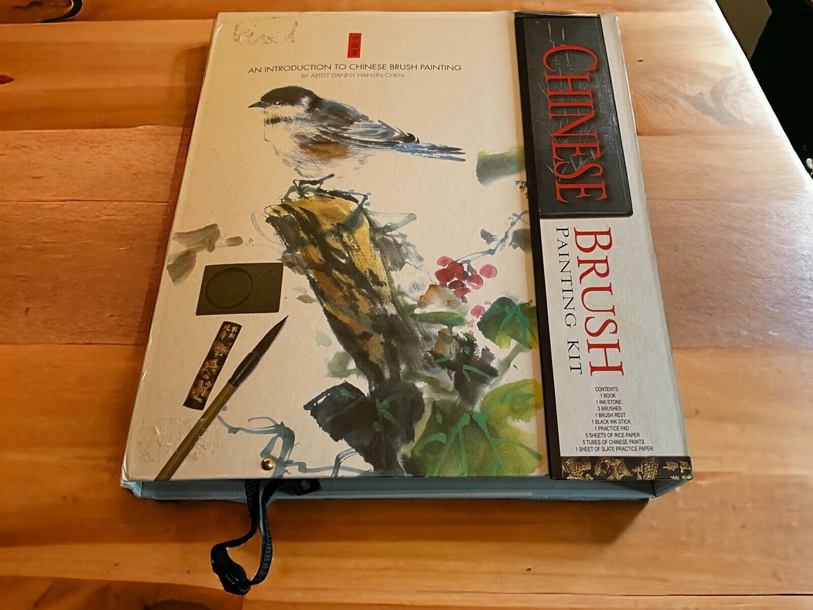 Chinese brush painting kit by 1118 Emporium featuring traditional brushes and instructional book with bird artwork