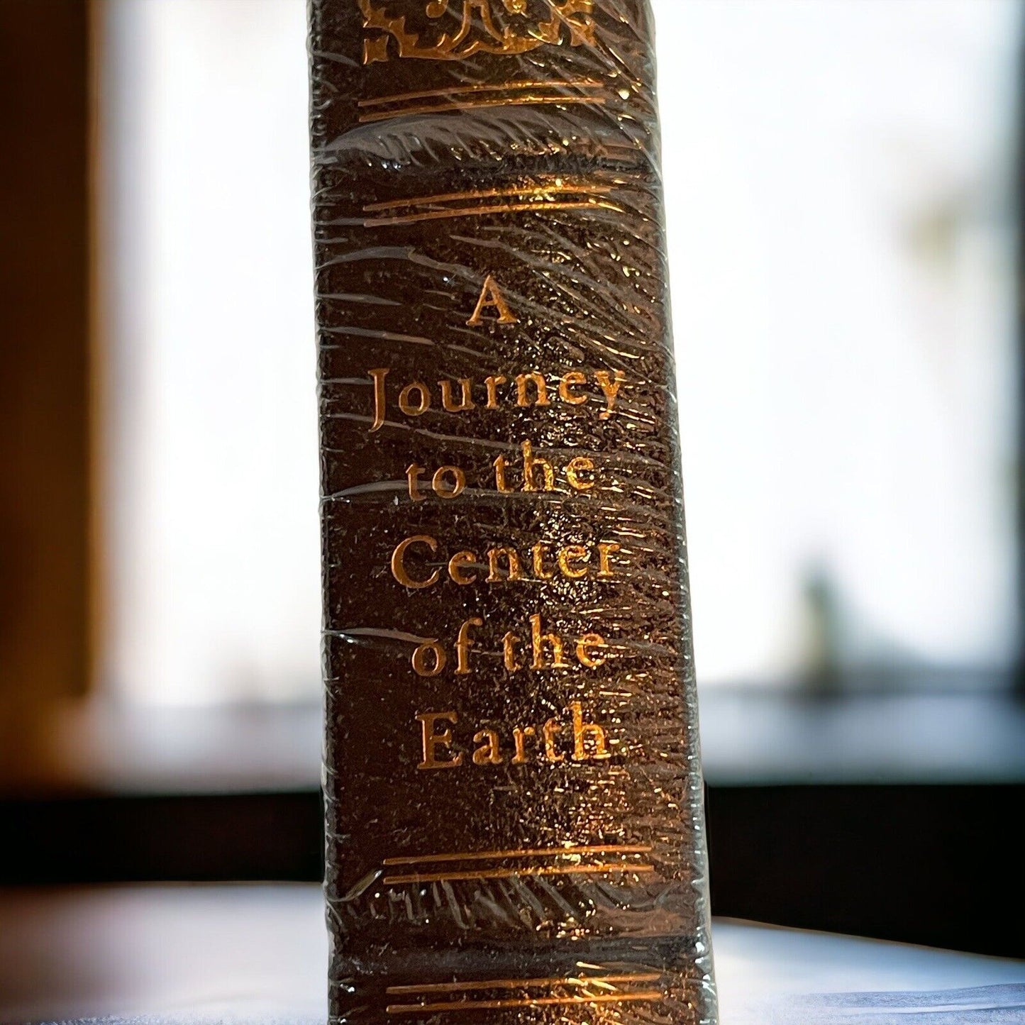 Collectible hardcover science fiction novel A Journey to the Center of the Earth with gold embossed spine