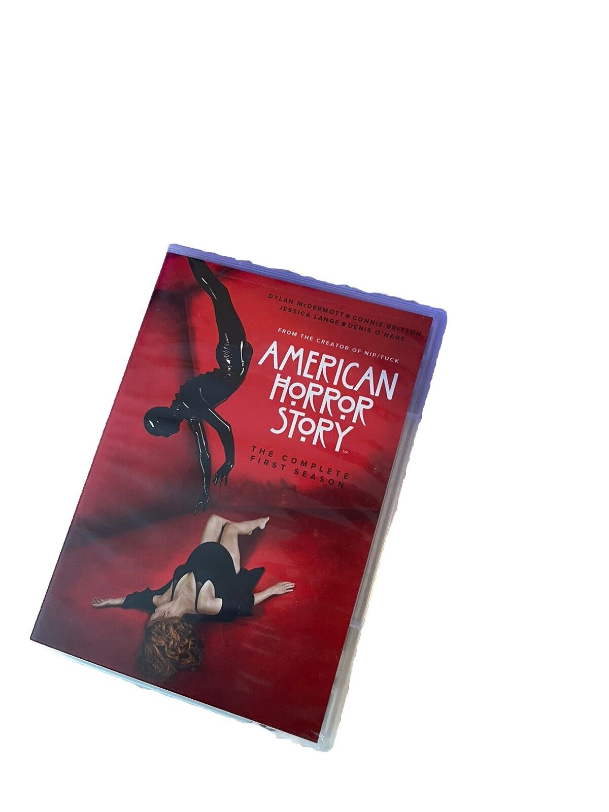 American Horror Story season 1 DVD with red cover featuring dark artistic imagery