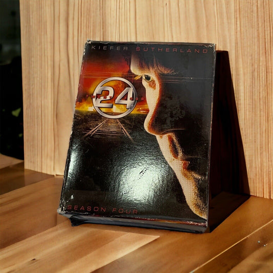 24 TV series DVD lot showing season four with Kiefer Sutherland on the cover standing on wooden surface