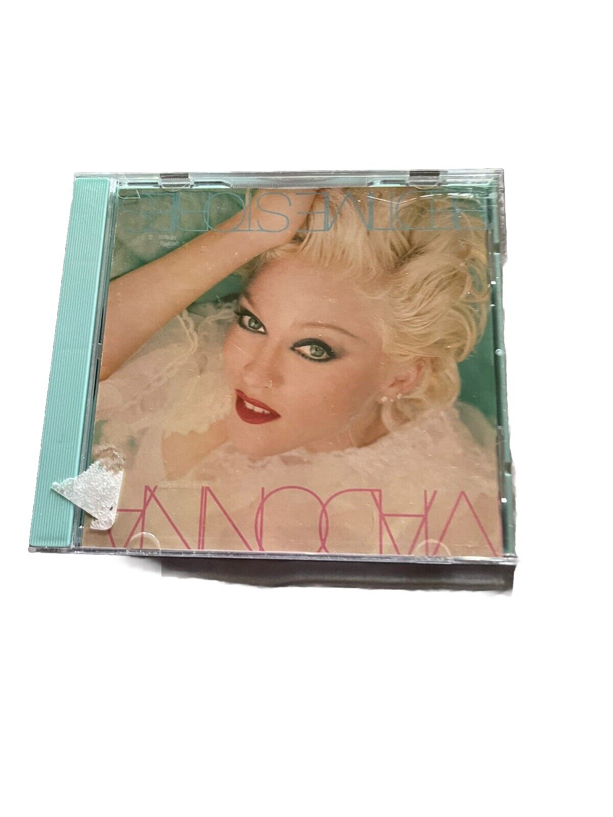 Madonna Bedtime Stories CD album cover featuring Madonna with platinum blonde hair and smoky eye makeup