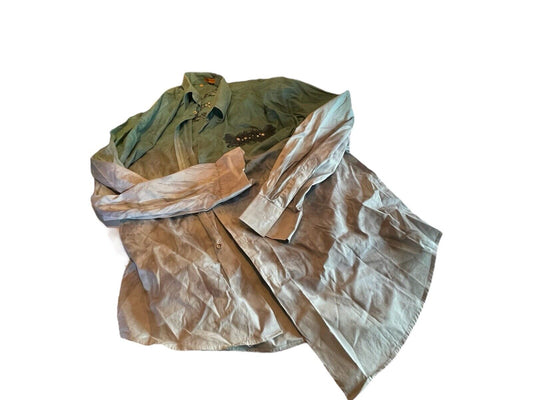 Wrinkled men's 5XL casual shirt in muted green and gray colors laid flat