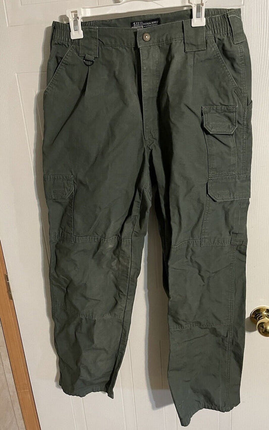 Men's tactical cargo pants in dark green with multiple pockets and durable fabric