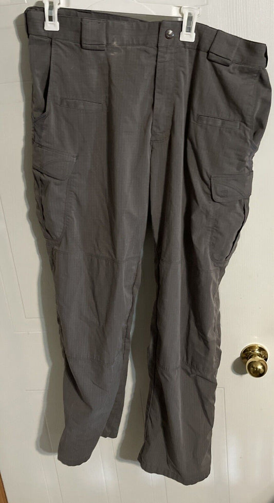 Men's tactical cargo pants in dark gray with multiple pockets ideal for outdoor and work use