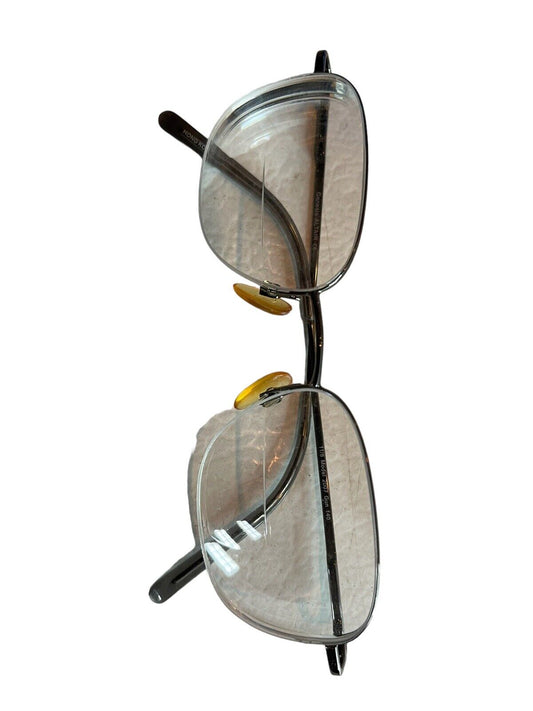 Modern square eyeglass frames with clear lenses and black metal temples from 1118 Emporium