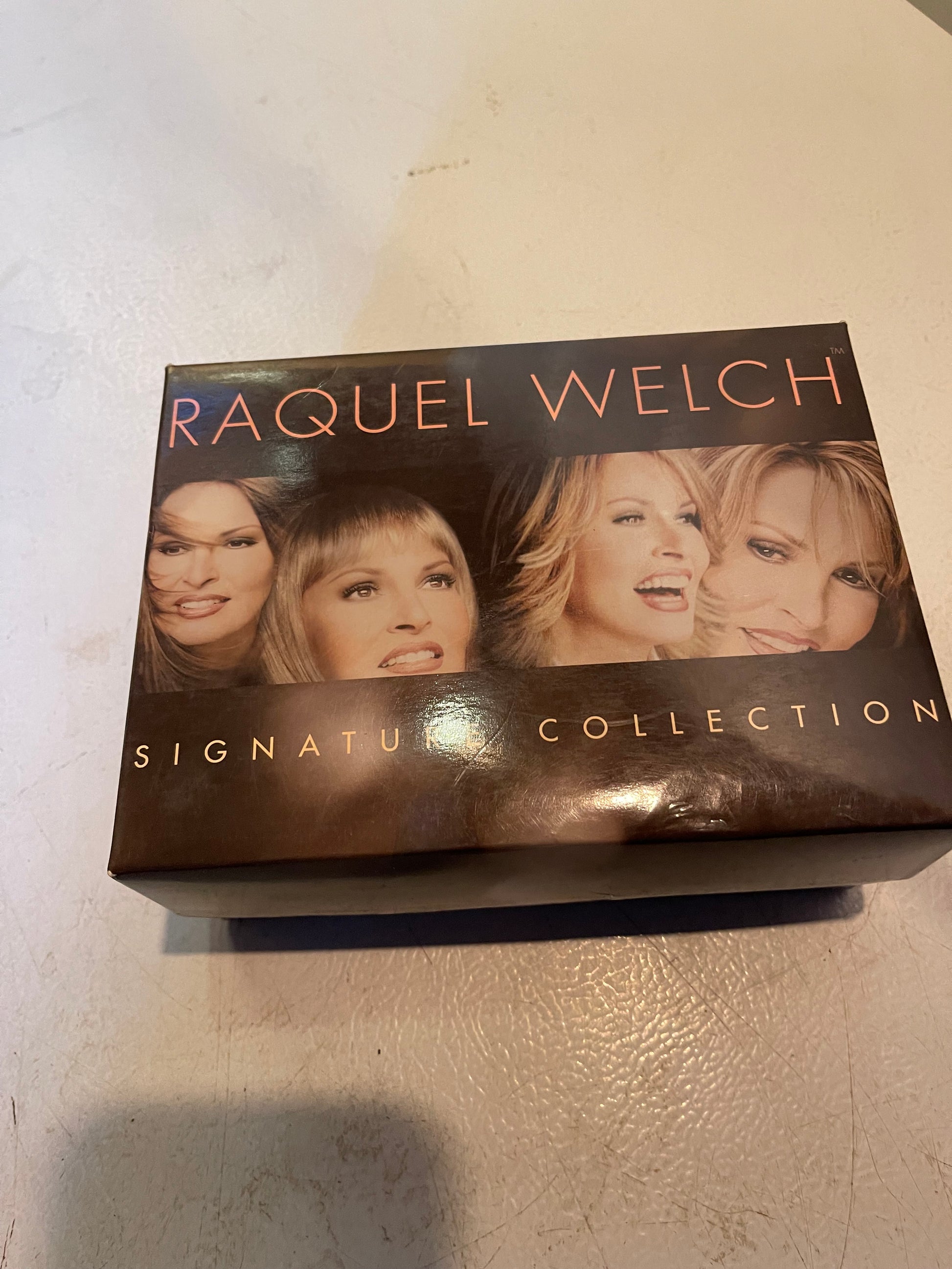 Raquel Welch Signature Collection box featuring luxury women’s wigs realistic styles by 1118 Emporium