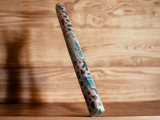 1118 Emporium leopard print self adhesive vinyl roll standing on wooden surface