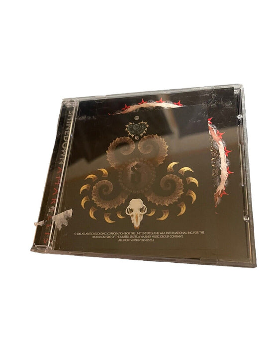 Shinedown Amaryllis CD album case featuring dark artistic cover with intricate design