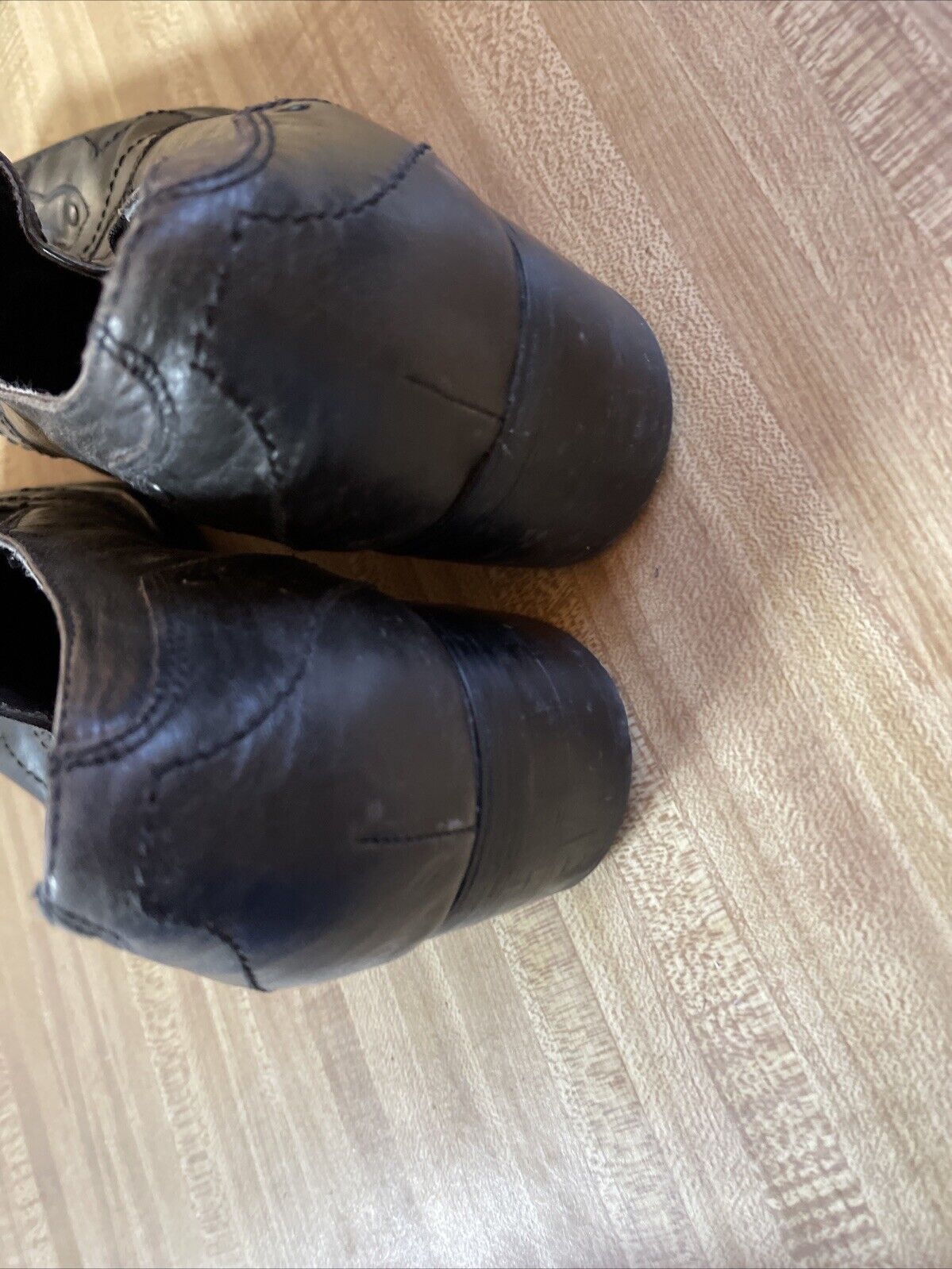 Back Stage by Skechers shoes black leather men's dress shoes from 1118 Emporium shown from the heel on wooden floor