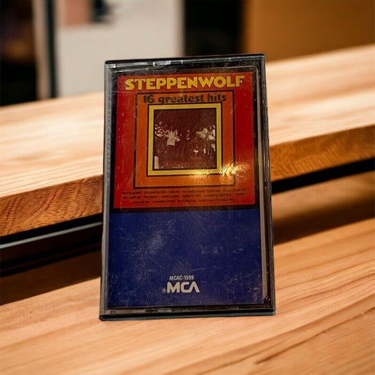 Steppenwolf 16 Greatest Hits cassette tape with vintage cover art on wooden surface