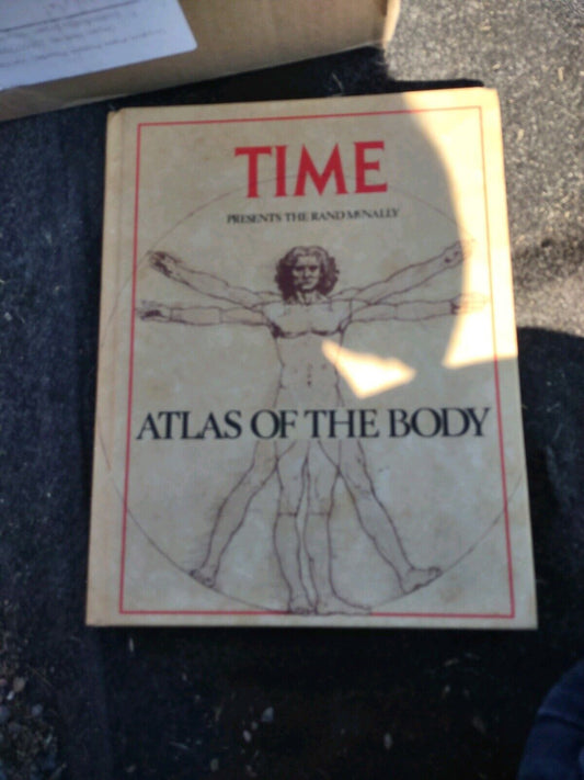 Cover of the atlas of the human body book featuring Vitruvian Man illustration by Time magazine