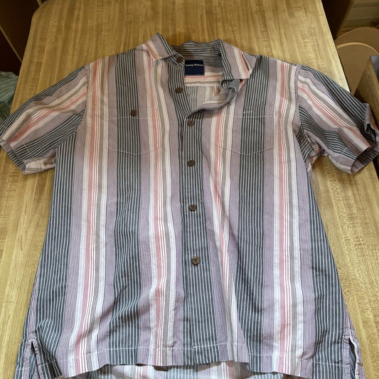 Tommy Bahama silk blend shirt with vertical striped pattern in muted colors on wooden surface